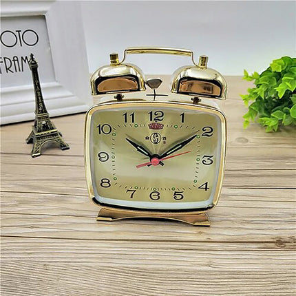 Piccola sveglia meccanica con campanelli